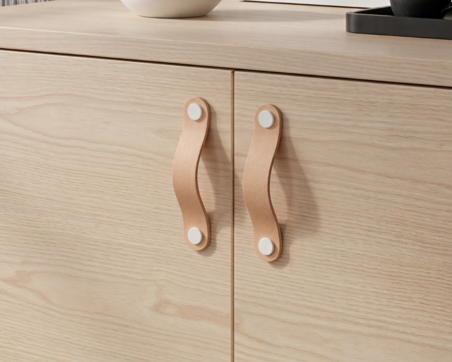 maniglie in pelle beige naturale su un mobile moderno beige