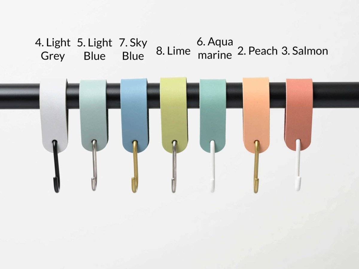 leather S hooks hanging coats on rail