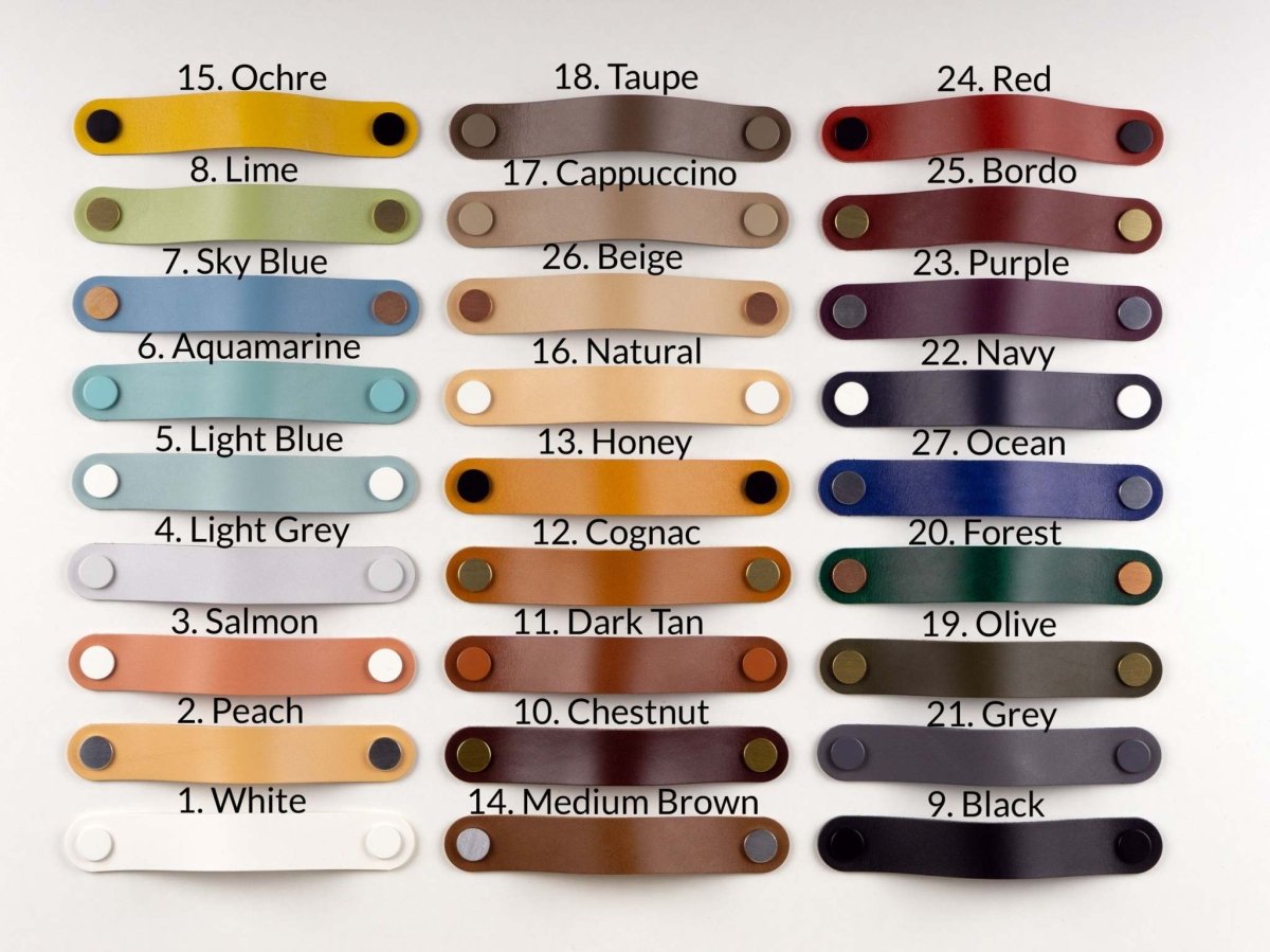 Variety of rounded leather drawer pulls in multiple colors with rivet ends for furniture handles