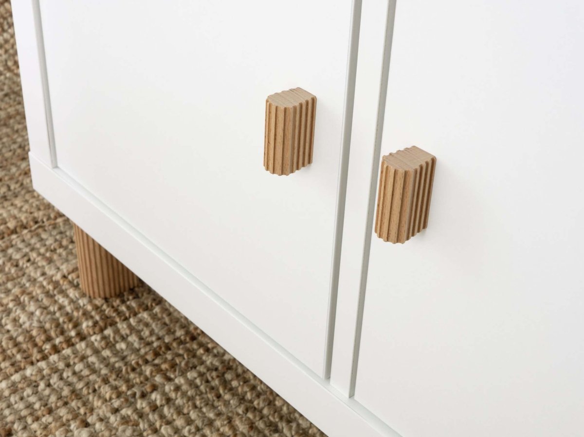 ikea kallax with door insert with wooden cabinet knobs with a ribbed design