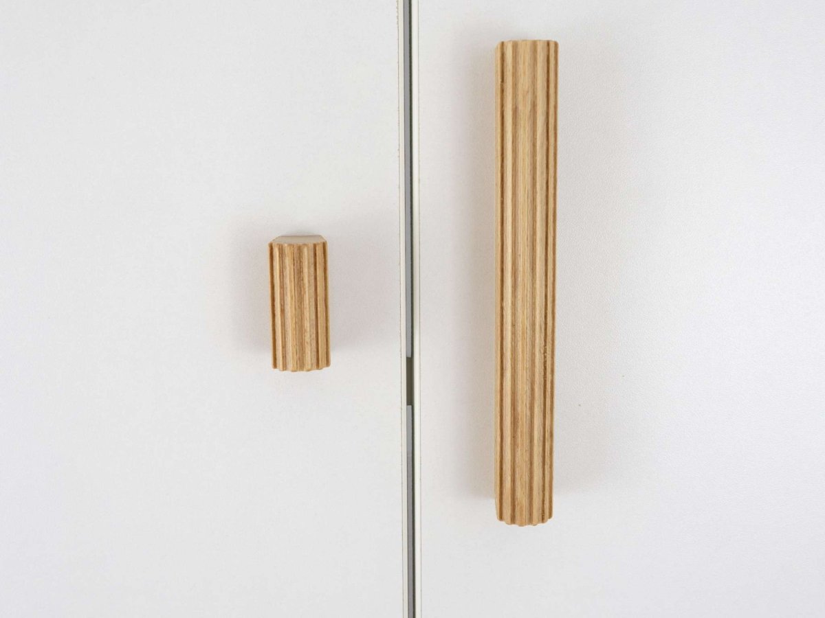 Wooden cabinet handles on a white background