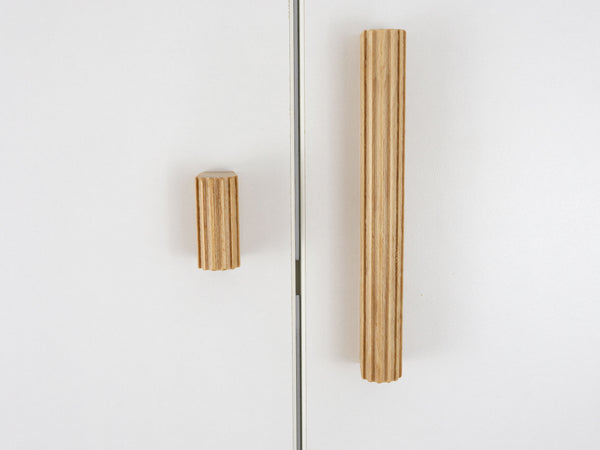 Wooden cabinet handles on a white background