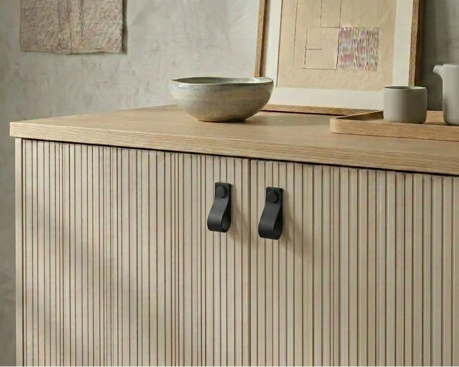 black leather pulls for furniture on wooden cabinet, scandinavian design