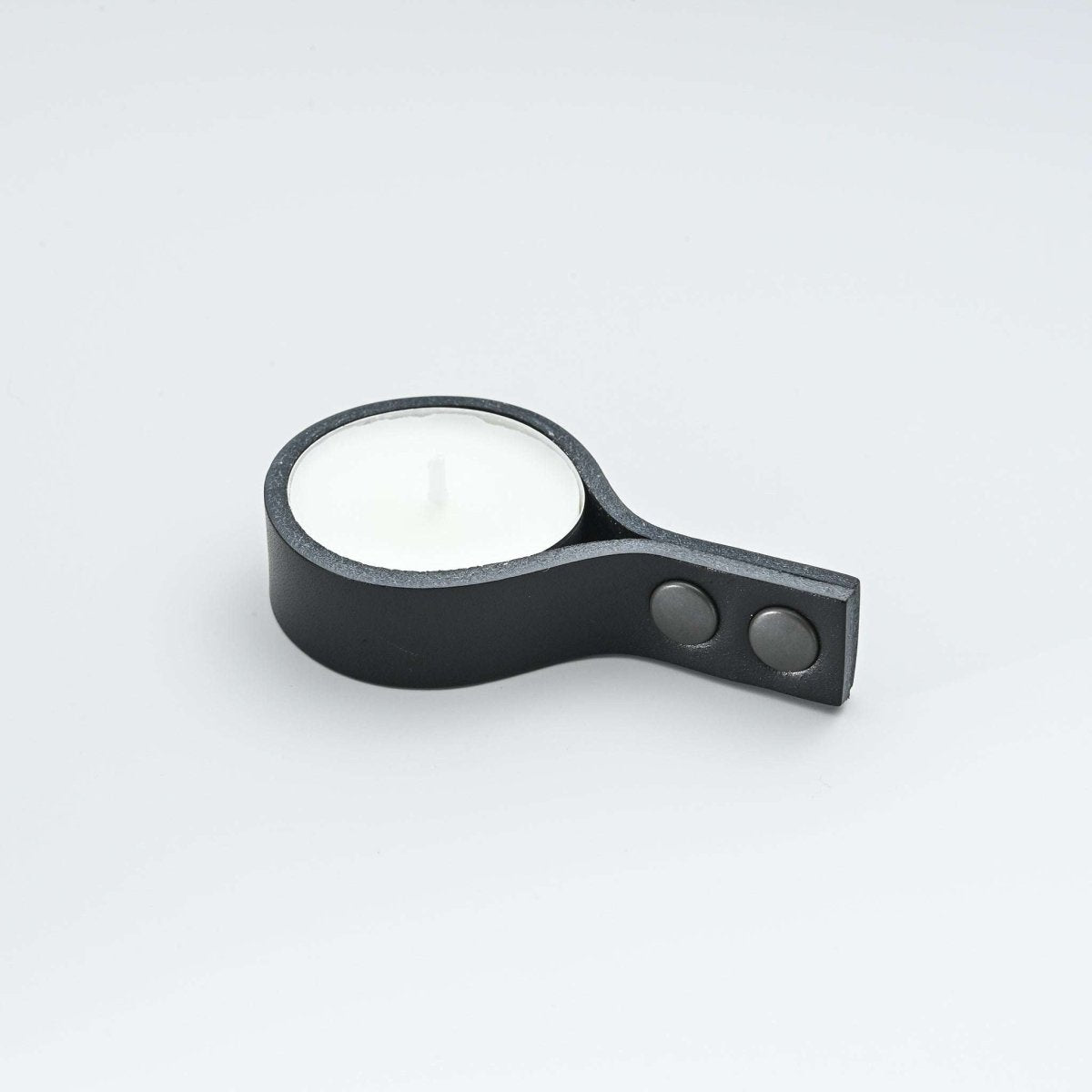 Minimalist black leather candle holder for tealight candles with straight ends and snap buttons