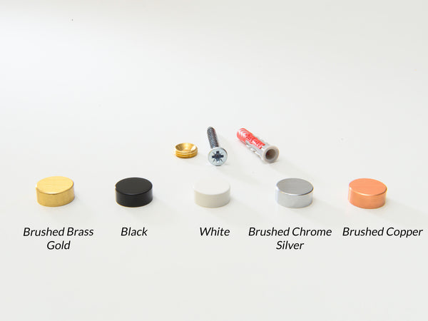 Set of metal knobs in various finishes on a white background