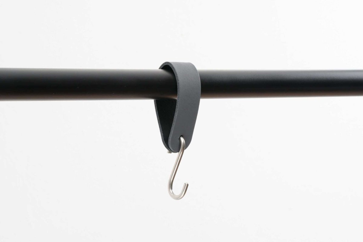 leather strap hook hanging on rail