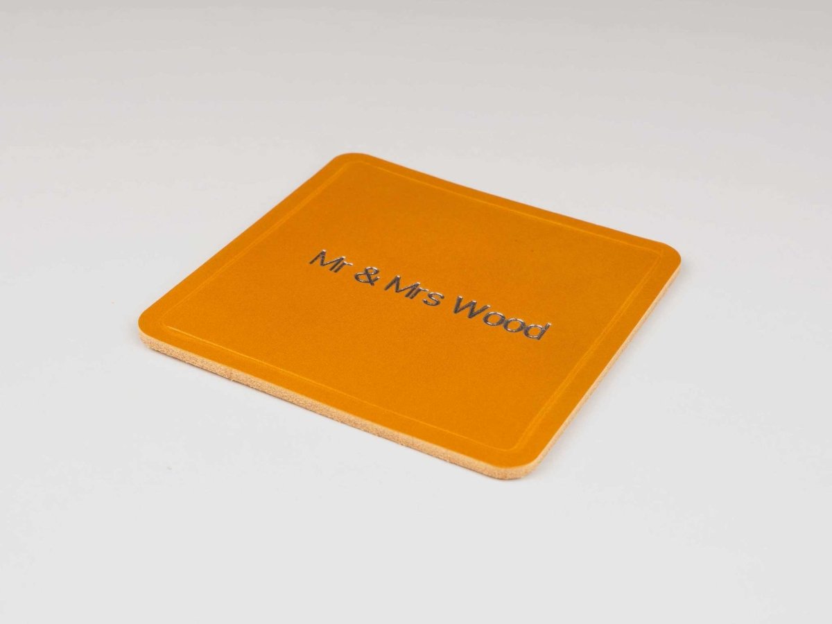 Square personalized leather coaster in premium Italian leather with custom engraved text Mr & Mrs Wood