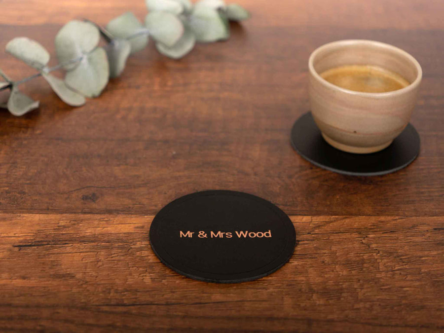 personalized leather coaster on a table