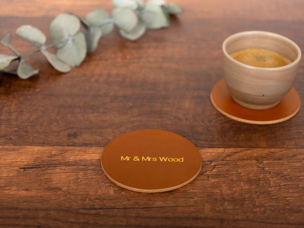 personalized leather coaster on a table