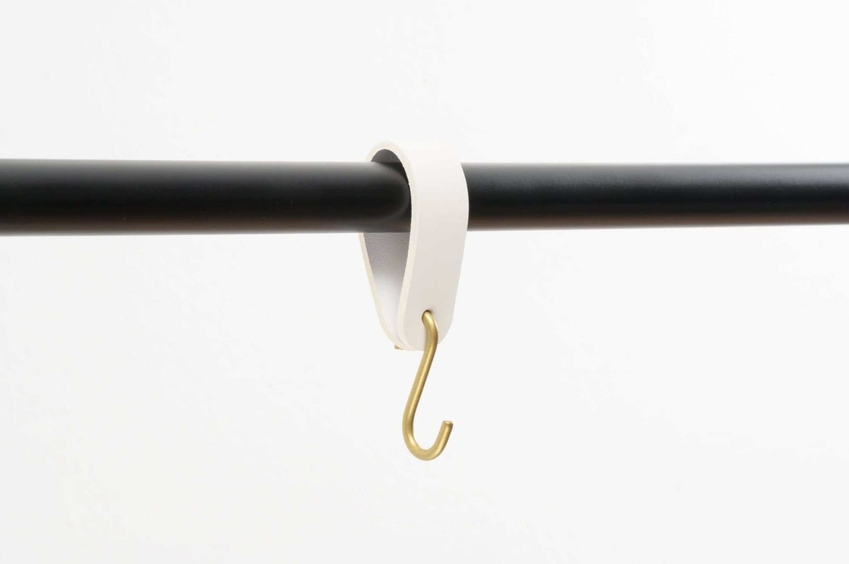 minimalist leather hook on clothing rail